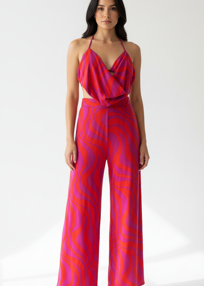 Woman wearing a pink and purple cowl neck top with palazzo pants